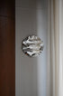 Round Psychedelic Mirror 50 cm — close-up detail of hand-shaped polished steel