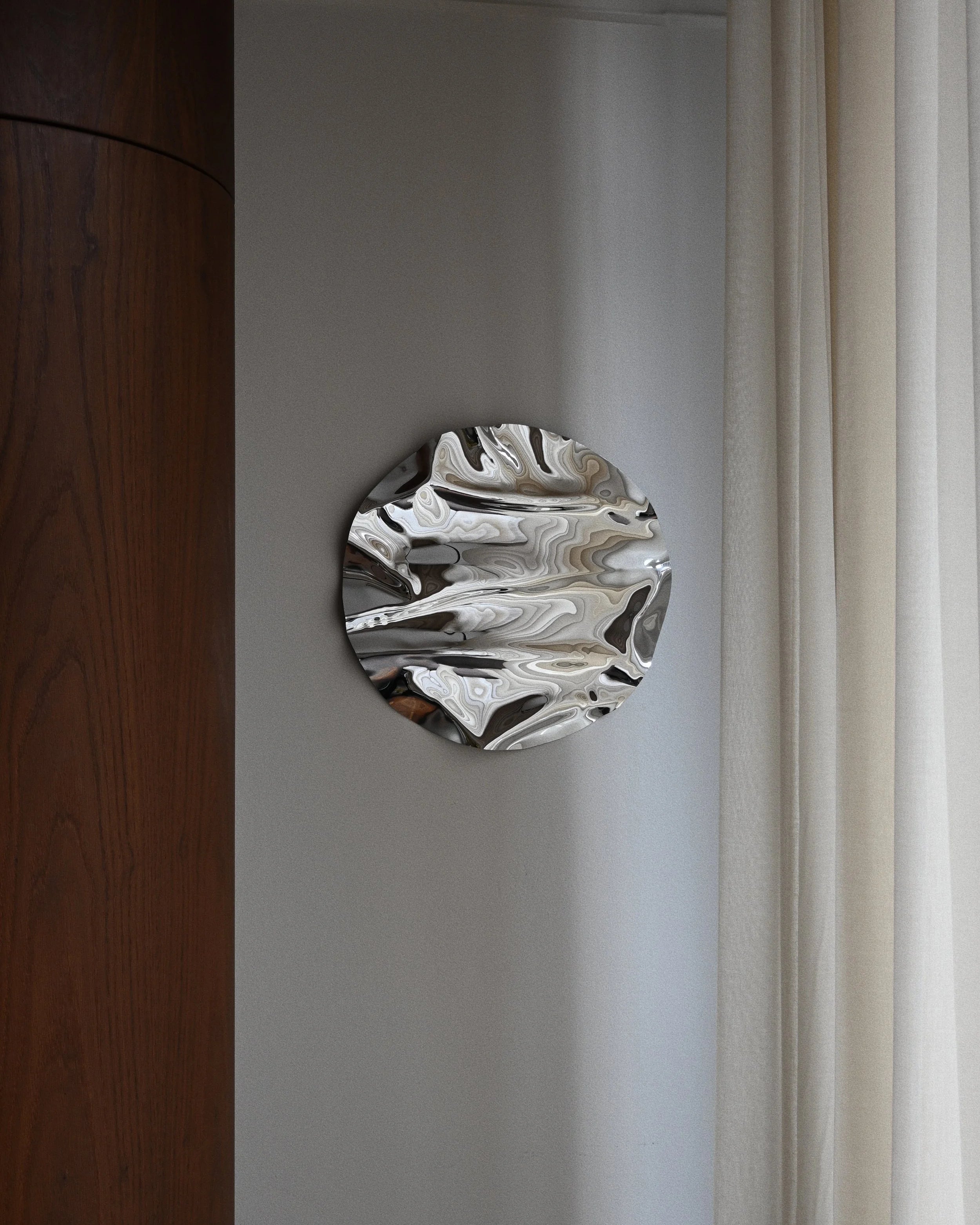 Round Psychedelic Mirror 50 cm — close-up detail of hand-shaped polished steel