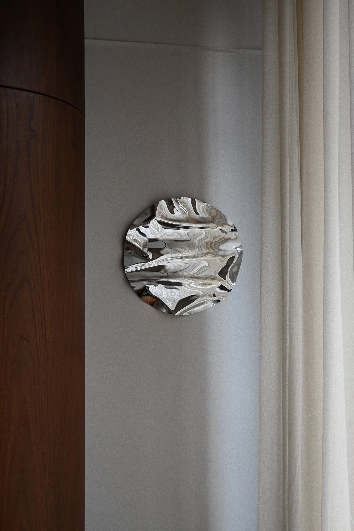 Round Psychedelic Mirror 50 cm — close-up detail of hand-shaped polished steel