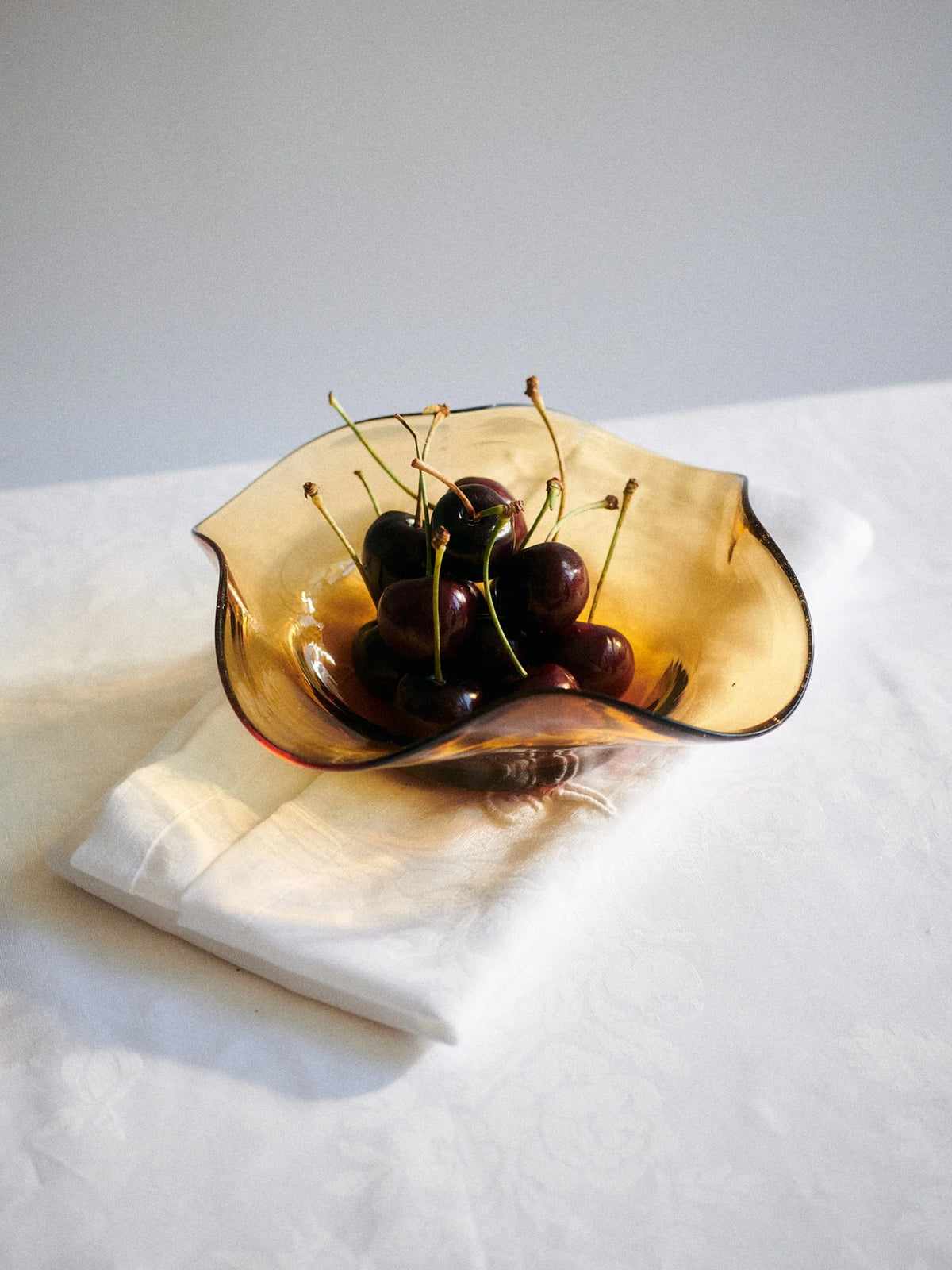 Akua Objects Michele Glass Bowl in Amber, curated by Shop Sommer in San Francisco