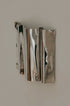 Psychedelic Wall Sconce — close-up detail of polished stainless steel
