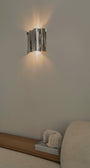 Psychedelic Wall Sconce by Caia Leifsdotter — polished stainless steel, front view