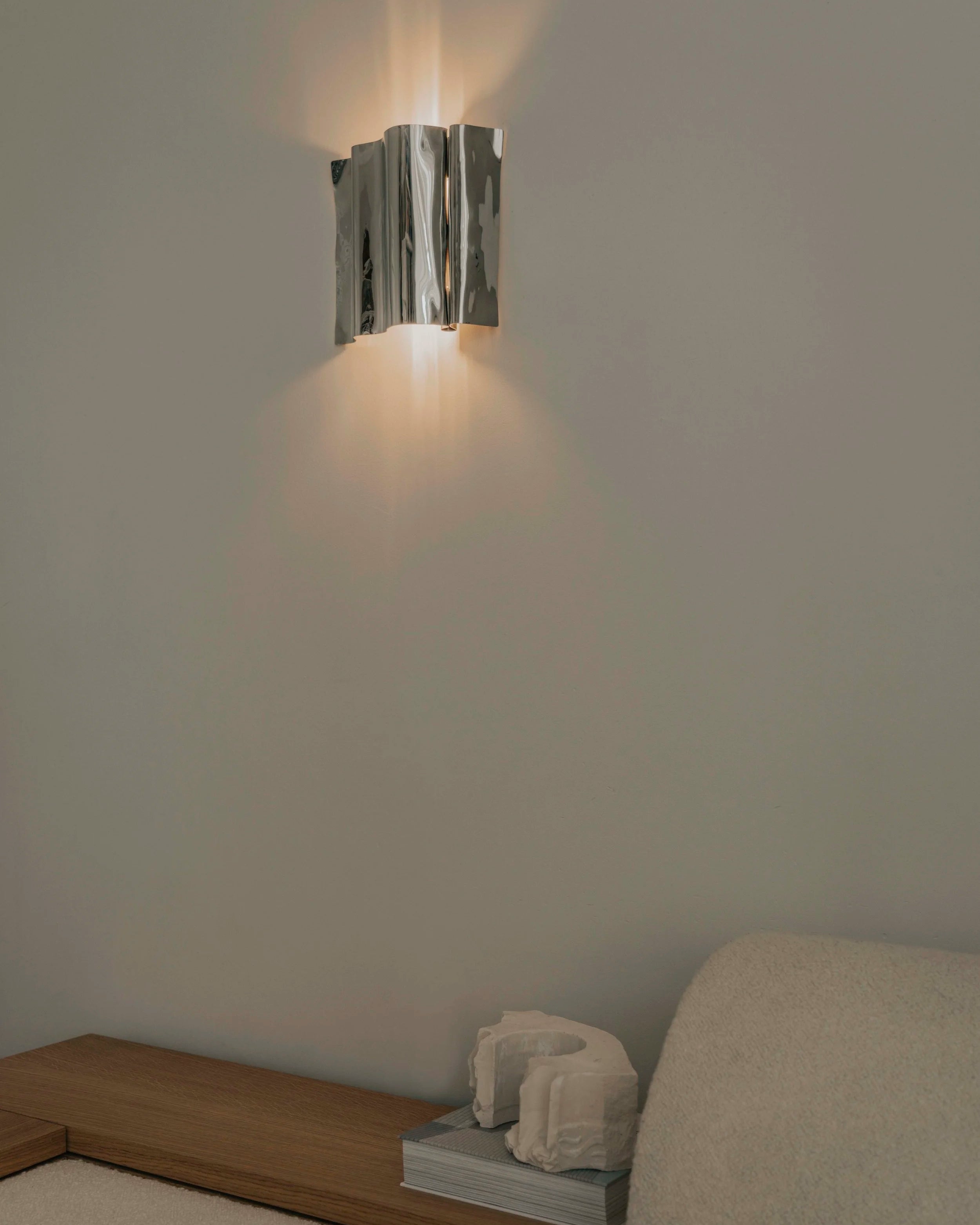 Psychedelic Wall Sconce by Caia Leifsdotter — polished stainless steel, front view