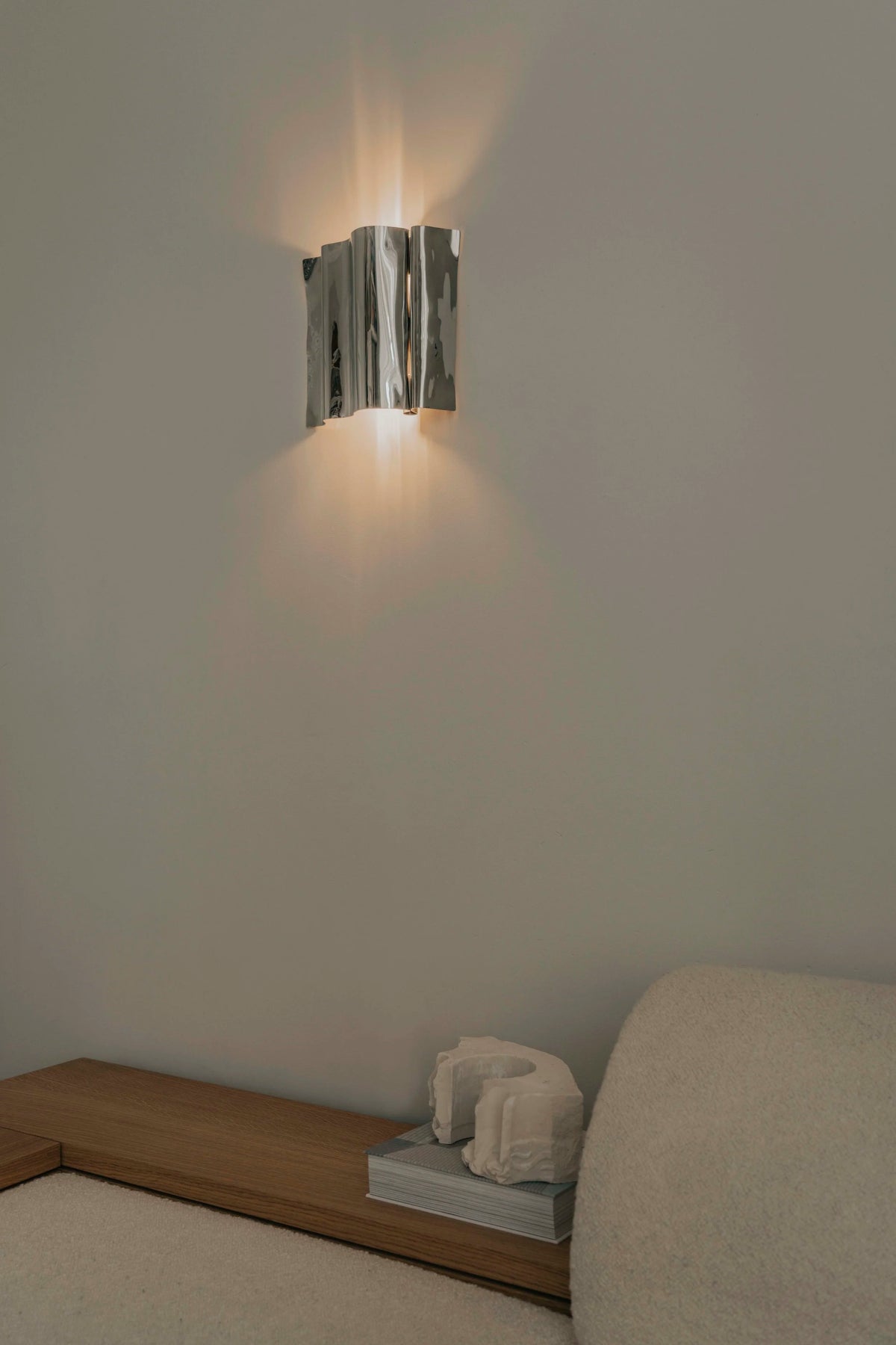 Psychedelic Wall Sconce by Caia Leifsdotter — polished stainless steel, front view