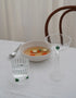 Table Setting with handmade glassware with green accents