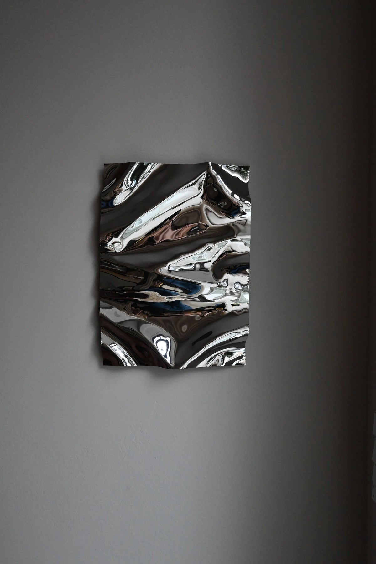 Psychedelic Mirror 35*50 cm by Caia Leifsdotter — hand-shaped polished steel, front view