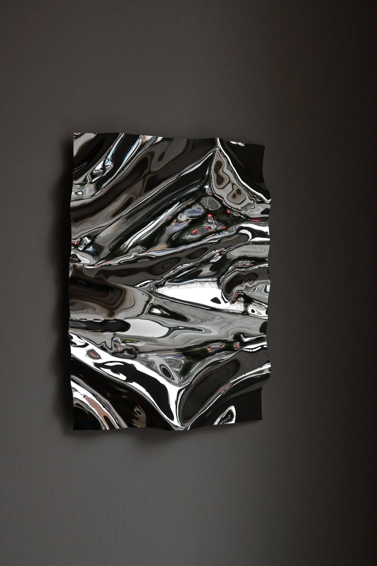 Psychedelic Mirror 35*50 cm — close-up detail of hand-shaped polished steel