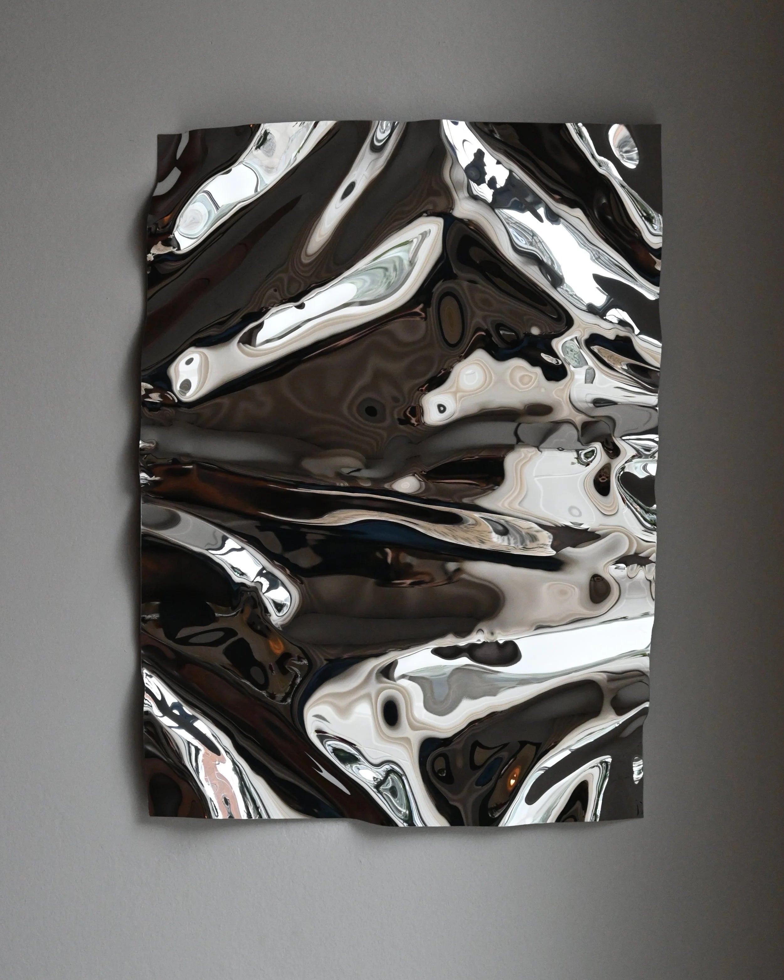 Psychedelic Mirror 50*70 cm by Caia Leifsdotter — hand-shaped polished steel, front view