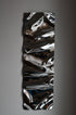 Psychedelic Mirror 30*100 cm — hand-shaped polished steel, angle view showing craftsmanship