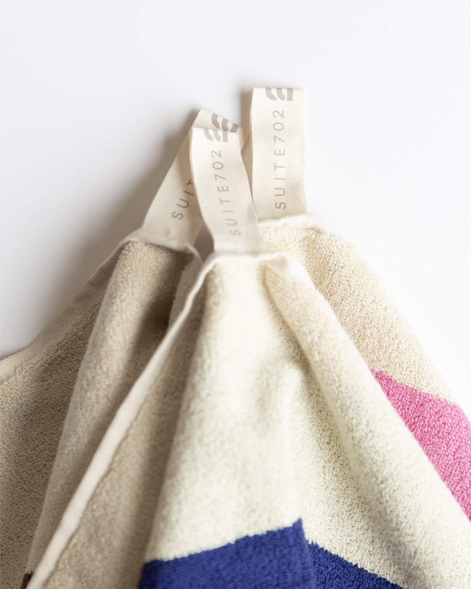 Sky blue Bordeaux towel by Suite 702, showing soft, plush fabric with a vibrant color and subtle woven texture.