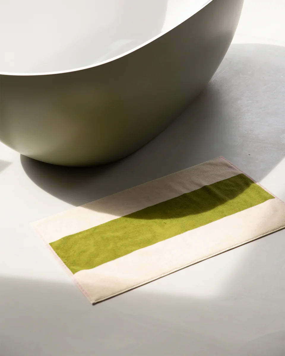 Pink Olive bath mat measuring 50x80 inches, soft and plush, from Suite 702, designed for bathroom comfort and style.