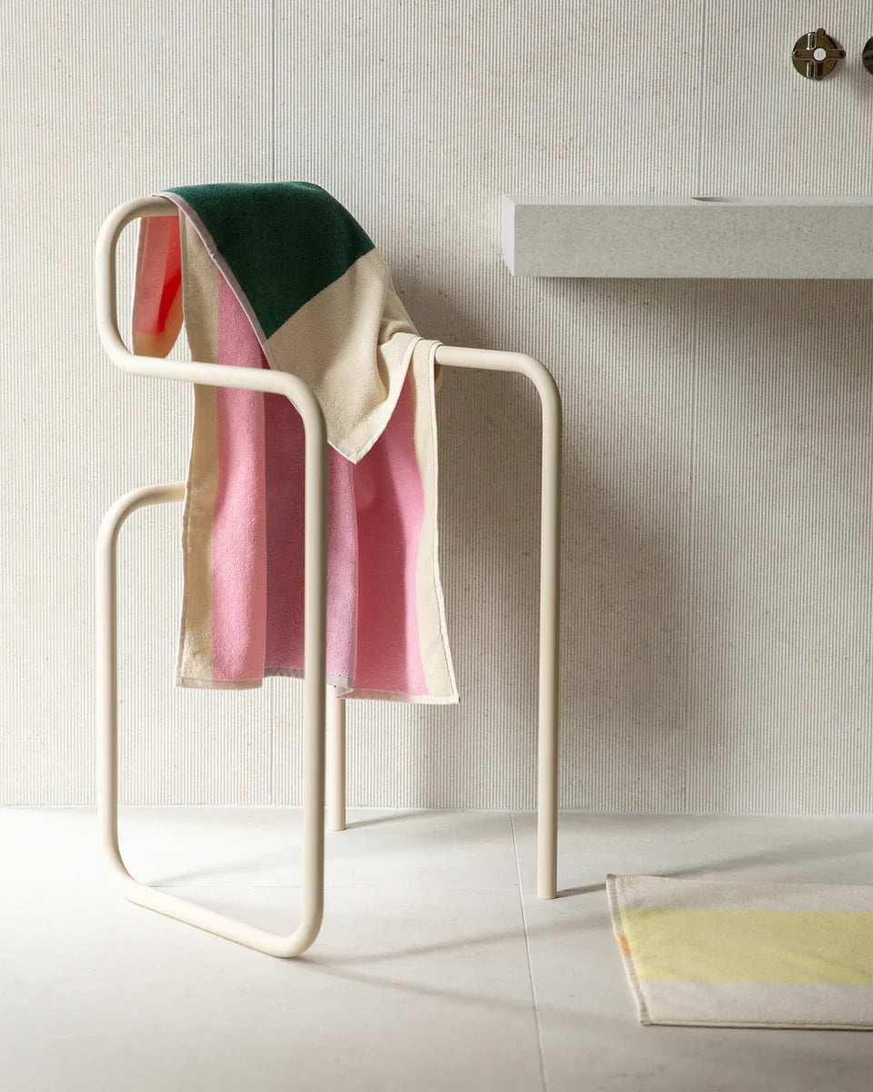 Dark green and pink Suite 702 bath towel, 70x140 inches, displayed folded with soft, plush fabric texture.