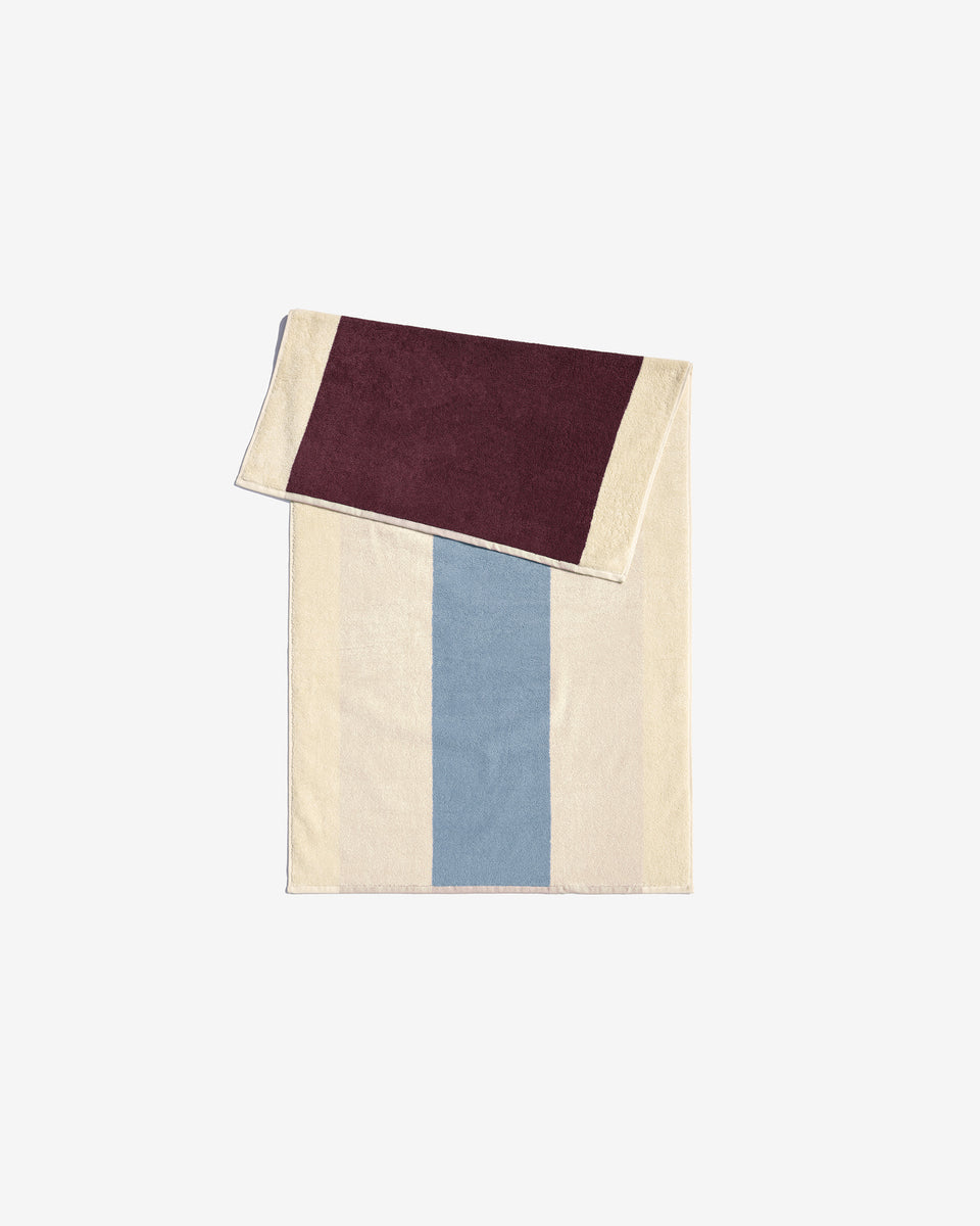 Sky blue Bordeaux towel by Suite 702 with soft, absorbent fabric displayed on a white background.