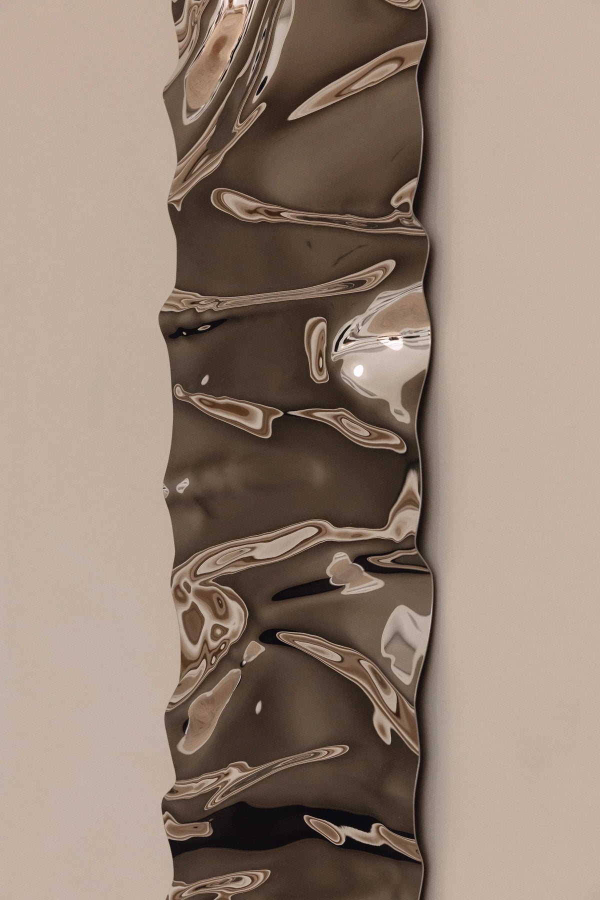 Psychedelic Mirror 30*100 cm — close-up detail of hand-shaped polished steel