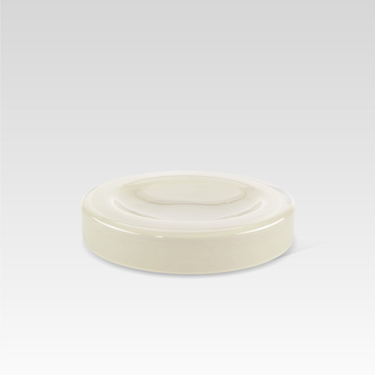 A handmade vanilla white glass bowl with a smooth surface and rounded edges, displayed against a neutral background.