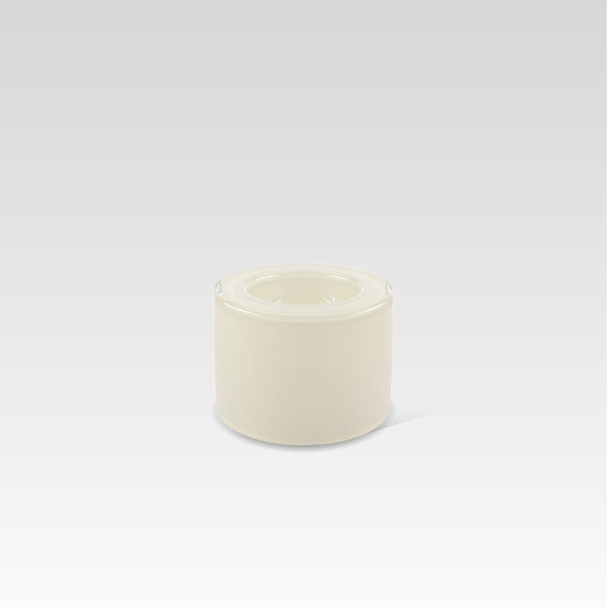 A high vanilla-colored handmade glass bowl on a plain background, designed to create surface tension optical illusion when filled.